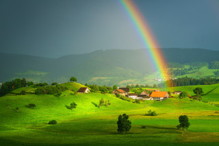 Rainbow green hillside houses trees - free landscape wallpaper
