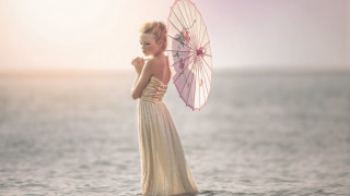 Woman dress umbrella water sunset 2 - emma geary free wallpaper