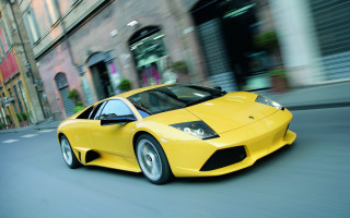 Yellow sports car cityscape rain - a tall building free wallpaper for desktop