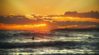 Surfing sunset ocean wave beach - a wave free wallpaper