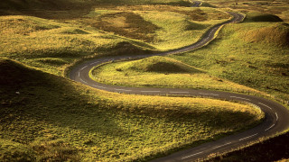 Winding road green hillside grass - winding free wallpaper