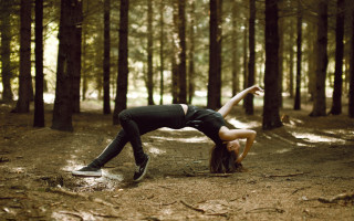 Woman handstand woods cityscape beach - a handstand free wallpaper