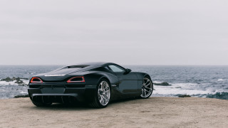 Black sports car beach ocean 2 - a gray sky free wallpaper