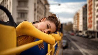 City street woman yellow fence - city background free wallpaper for desktop