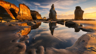 Beach rocks reflected sky dusk - a body of water free wallpaper for desktop