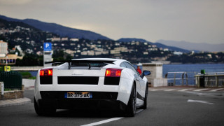 White sports car cityscape waterfront - a white sports car free wallpaper for desktop