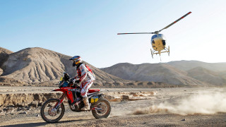 Man dirtbike helicopter desert mountains - over a desert landscape free wallpaper