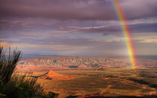 Rainbow mountains plains mystical colors - a dark cloud in the sky free wallpaper
