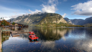 Red boat lake mountains clouds - a red boat free wallpaper