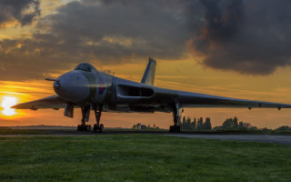 Jet plane sunset runway clouds - the background and a sun setting free wallpaper