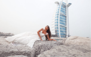 Woman white dress sitting rocks - tall free wallpaper