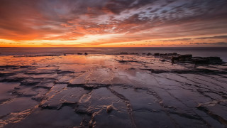 Sunset rocky beach cloudy sky 2 - the foreground and a sky free wallpaper for desktop
