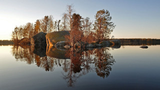 Lake rocks forest sunset autumn - a rock in the middle of it free wallpaper