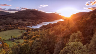 Scenic lake mountains trees sunset - a scenic view of a lake free wallpaper