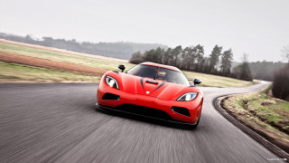 Red sports car country road - grassy free wallpaper for desktop