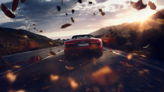 Red sports car leaves mountain - the air above free wallpaper