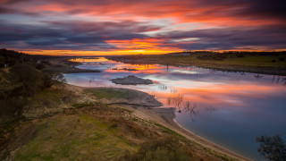 Sunset river island boats cityscape - free landscape wallpaper