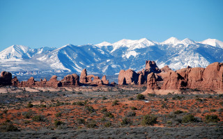 Mountain range snow capped blue - a blue sky in the foreground free wallpaper