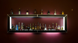 Shelf alcohol bottles red wall - free holidays wallpaper