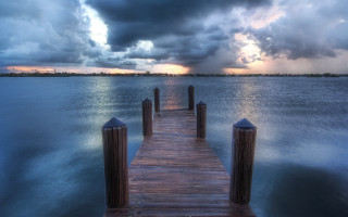 Wooden dock ocean storm clouds - a wooden dock free wallpaper