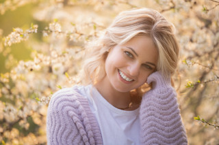 Smiling woman cherry blossoms outdoors - emma geary free wallpaper