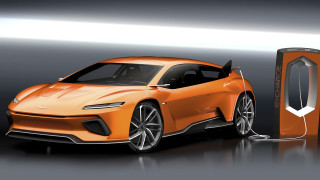 Futuristic orange car charging dark - concept design free wallpaper