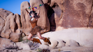 Woman jumping dress rock formation - a stick free wallpaper