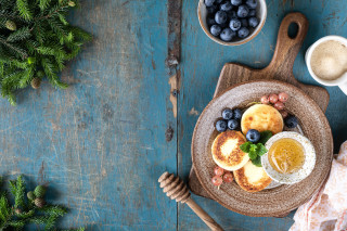 Pancakes blueberries coffee pine branches - a blue table free wallpaper