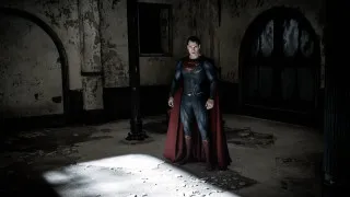 Superman costume dark room shadow - promotional image free wallpaper