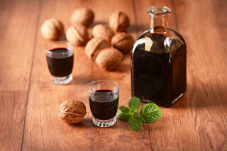 Liquid bottle glass nuts wooden - product photography free wallpaper