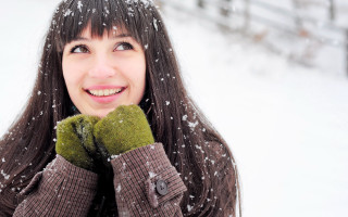 Woman smiling snow winter brownjacket - a brown jacket free wallpaper for desktop