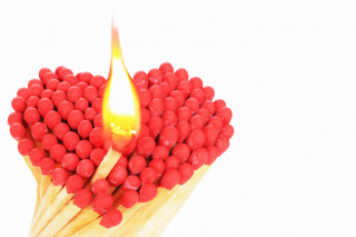 Matchstick lit red flame flower - a yellow flame free wallpaper