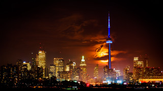 City skyline tower night orange - orange glow free wallpaper