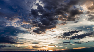 Sunset clouds plane mountain ocean 2 - a mountain in the distance free wallpaper