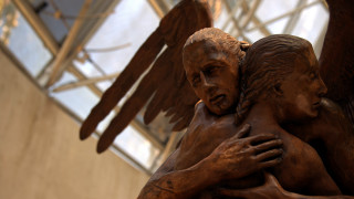 Bronze statue hugging woman wings - new sculpture free wallpaper