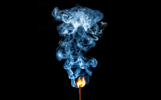 Matchstick lit smoke black background 2 - a black background free wallpaper for desktop