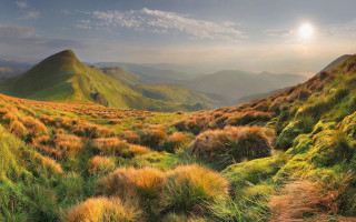 Grassy valley mountain sunset clouds 2 - a few cloud free wallpaper for desktop