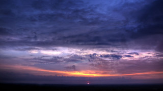 Sunset clouds sunrays horizon cityscape - a few cloud free wallpaper for desktop