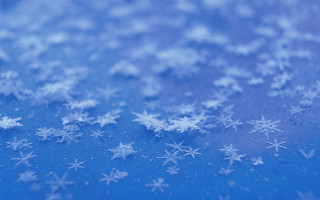 Blue snow flakes macro outdoors - a blue surface free wallpaper