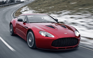 Red sports car driving snow 2 - the front of its free wallpaper
