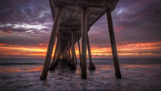 Pier sunset water clouds city 2 - underneath free wallpaper