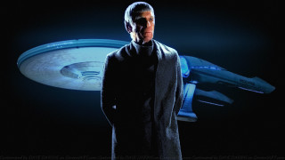 Man black coat blue object - a spaceship in the background free wallpaper