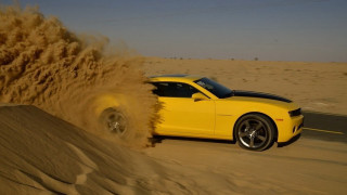 Yellow car desert sand blowing - dusty free wallpaper