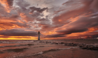 Lighthouse beach sunset clouds water - david paton free wallpaper