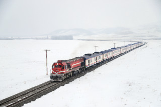 Train snowy countryside power lines - a train traveling free wallpaper for desktop