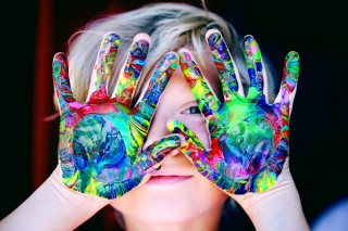 Young girl painted hands eye - a childs drawing free wallpaper