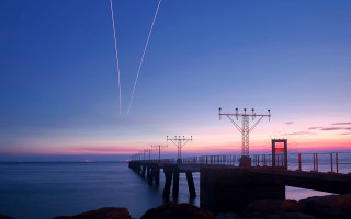 Pier plane sunset contrails water 3 - almada negreiro free wallpaper