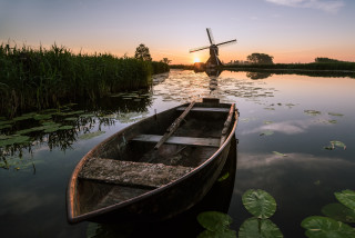 Boat windmill lily pads sunset - a windmill in the background free wallpaper