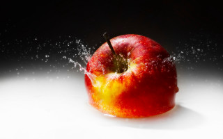 Red apple water splash black 2 - a red apple free wallpaper for desktop