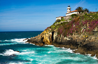 Lighthouse cliff ocean blue sky - free landscape wallpaper